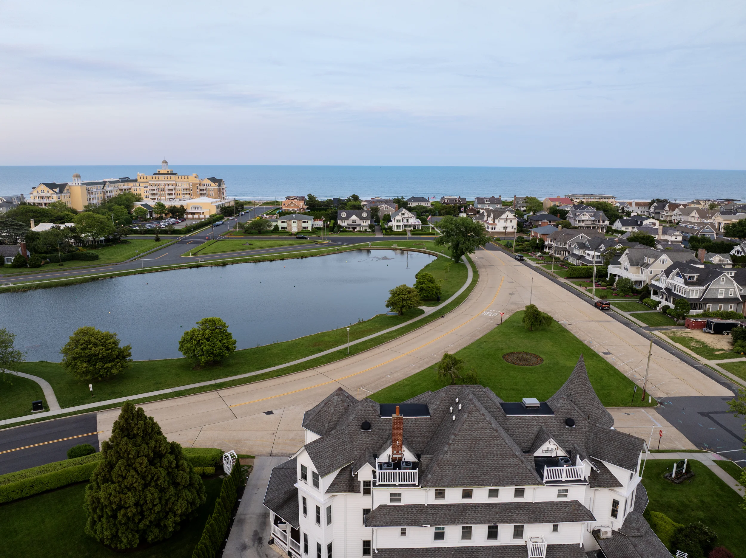 Aerial view of lake and ocean at dusk